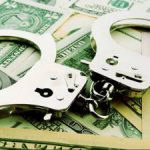 230-money-laundering-cases- hand cuff – dollars