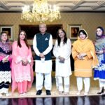 President Dr. Arif Alvi in a group photo with a delegation of Women Chamber of Commerce and Industry Peshawar at Aiwan-e-Sadr Islamabad on 16 Jul 2022