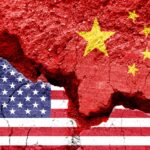 Flag of USA and China on a cracked background. Concept of crisis between two nations, Washington and Beijing